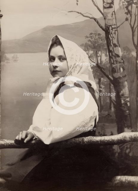 Photograph of a young girl in a white blouse and white headscarf, 1880-1890. Creator: Helene Edlund.
