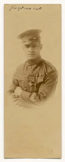 Photograph of Cpl. Lawrence McVey in uniform wearing the Croix de Guerre medal, ca. 1920. Creator: Alva Studio