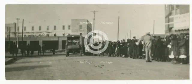 Photograph of people standing in a line on a street in Tulsa, Oklahoma, ca. 1920. Creator: Unknown.