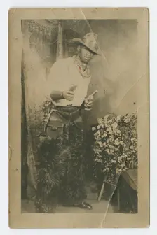 Photograph portrait of a man dressed as a cowboy, early 20th century. Creator: Unknown
