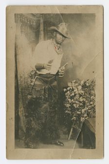 Photograph portrait of a man dressed as a cowboy, early 20th century. Creator: Unknown