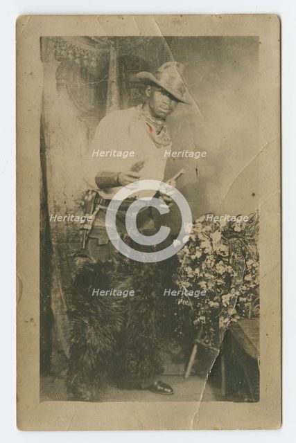 Photograph portrait of a man dressed as a cowboy, early 20th century. Creator: Unknown.