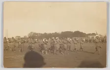 Photographic postcard of a military marching band, ca. 1917. Creator: Unknown
