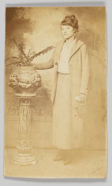 Photographic postcard of a woman, 1918-1930. Creator: The Rex Photo Studio