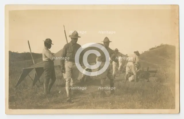 Photographic postcard of Charles Wilbur Rogan with his unit in the Philippines, 1910-1919. Creator: Unknown.