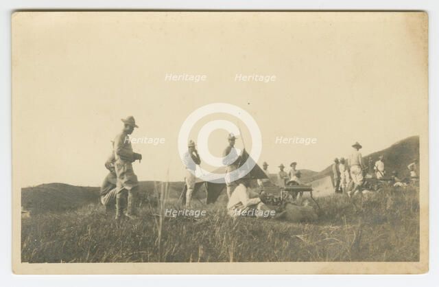 Photographic postcard of Charles Wilbur Rogan with his unit in the Philippines, 1910-1919. Creator: Unknown.