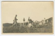Photographic postcard of Charles Wilbur Rogan with his unit in the Philippines, 1910-1919. Creator: Unknown
