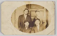 Photographic postcard of four unidentified men, 1906-1915. Creator: Unknown