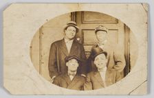 Photographic postcard of four unidentified men, 1906-1915. Creator: Unknown