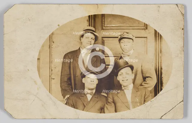 Photographic postcard of four unidentified men, 1906-1915. Creator: Unknown.