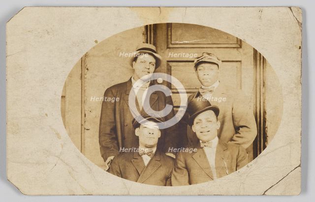 Photographic postcard of four unidentified men, 1906-1915. Creator: Unknown.