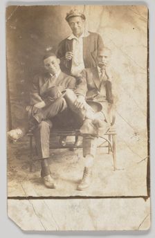 Photographic postcard of three unidentified men, 1904-1918. Creator: Unknown