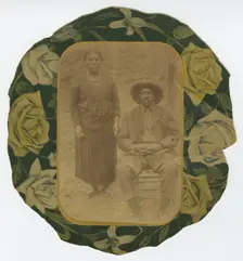 Photographic portrait of a man and woman on floral paper backing, early 20th century. Creator: Unknown