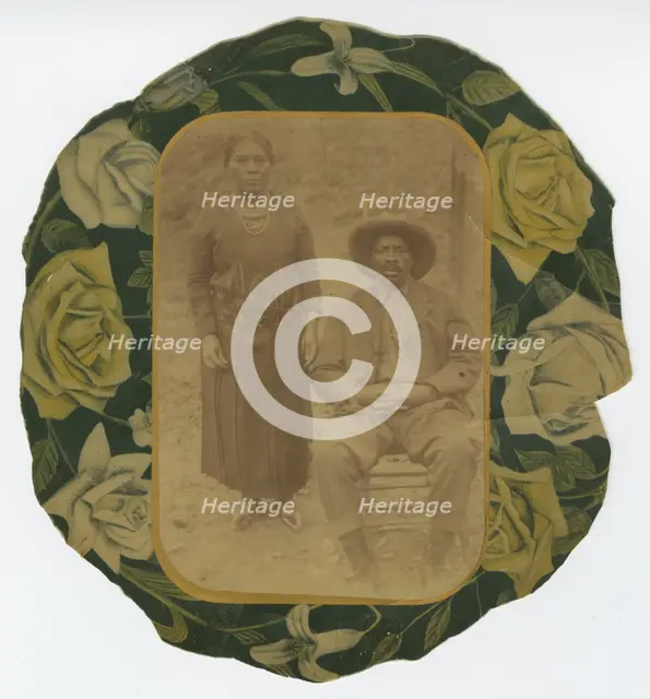 Photographic portrait of a man and woman on floral paper backing, early 20th century. Creator: Unknown.
