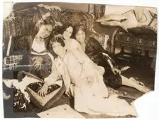 Photographic print of 4 women sitting in front of a sofa, early 20th century. Creator: Unknown
