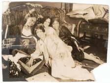 Photographic print of 4 women sitting in front of a sofa, early 20th century. Creator: Unknown