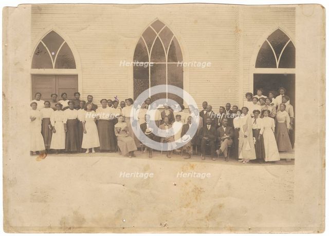 Photographic print of men and women in front of Vernon AME Church, Tulsa, ca. 1919. Creator: Unknown.