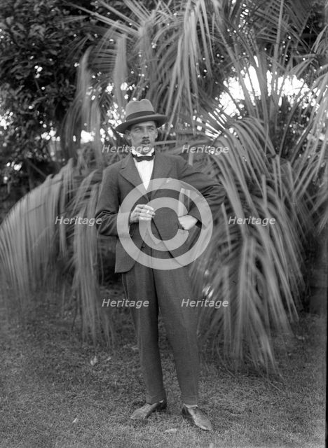 Photos and life story of John Henderson L'Estrange (1864-1913) standing and William Manderville Elli Creator: Robert Augustus Henry L'Estrange.