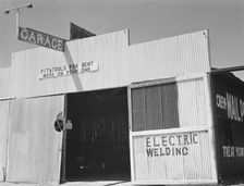 "Pit and tools for rent--work on your own", U.S. 99, Fresno County, California, 1939. Creator: Dorothea Lange