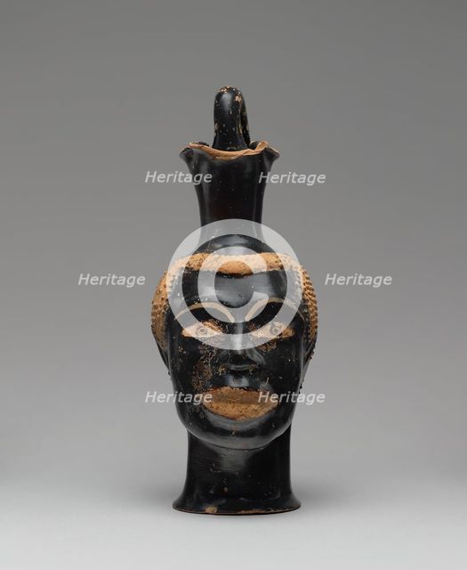 Pitcher (Oinochoe) in the Form of a Head of a Youth, about 510 BC. Creator: Class of Louvre H 62.