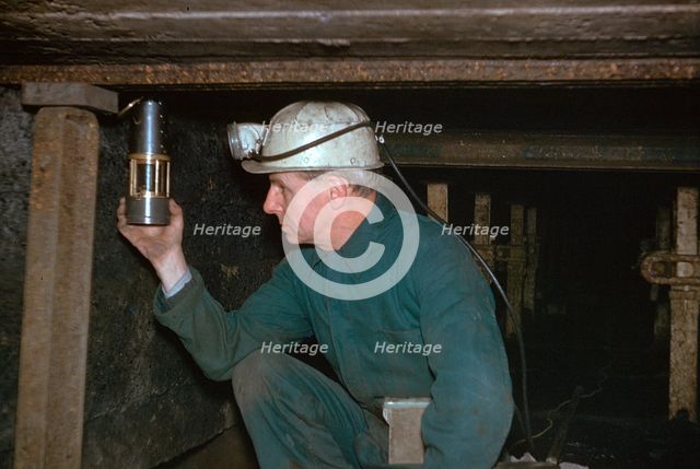 Pity Deputy tests for gas using Davy Safety Lamp.
