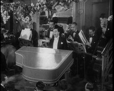 Pianist Playing the Piano and Singing "Stormy Weather", 1936. Creator: British Pathe Ltd