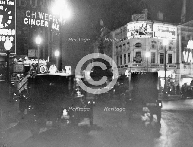 Piccadilly Circus at night, Westminster, London. Creator: Unknown.