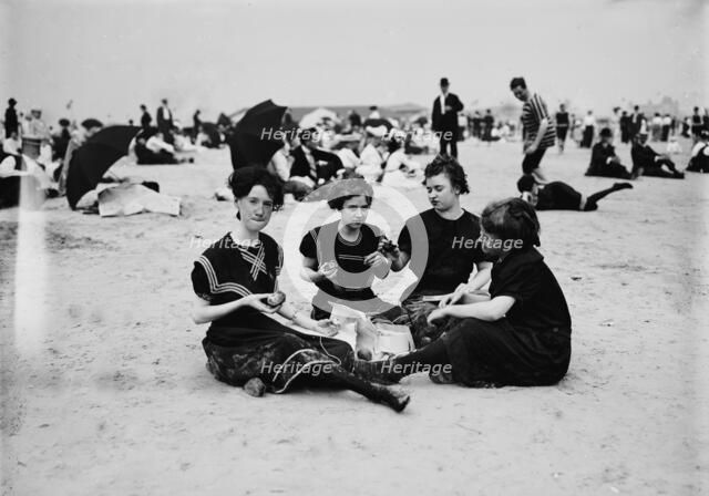Picnicing on the beach, between 1900 and 1905. Creator: Unknown.