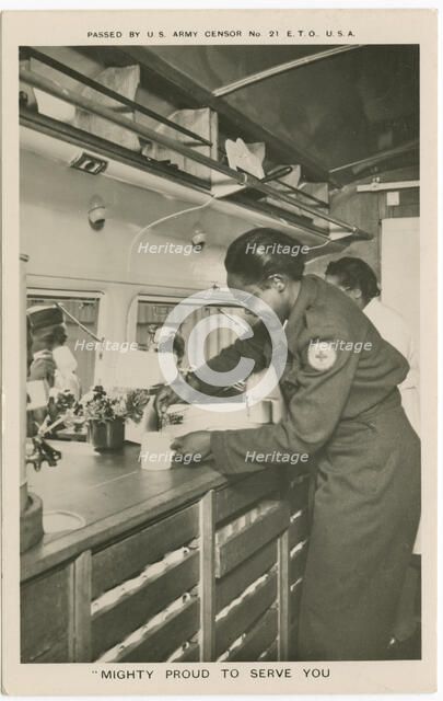 Picture postcard of a volunteer serving troops out of a Red Cross “Clubmobile", ca. 1945. Creator: Unknown.