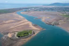 Piel and Roa Islands with Barrow-in-Furness and Black Combe fell in the background, Cumbria, 2021. Creator: Damian Grady
