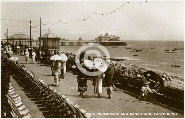 Pier, promenade and bandstand, Eastbourne, Sussex, c1920s(?). Artist: Unknown