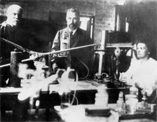 Pierre and Marie Curie, French scientists, at work in the laboratory. Creator: Unknown