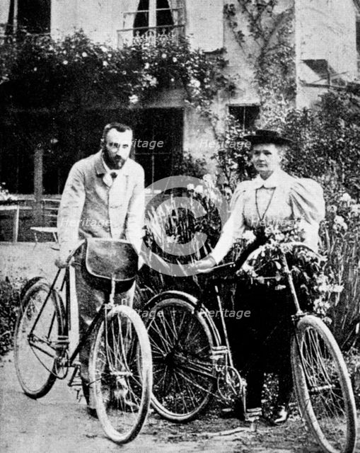 Pierre and Marie Curie, French physicists, preparing to go cycling. Creator: Unknown.