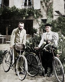 Pierre and Marie Curie, French physicists, preparing to go cycling