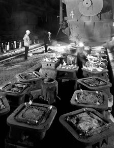 Pig casting at the Park Gate Iron & Steel Co, Rotherham, South Yorkshire, 1964. Creator: Michael Walters