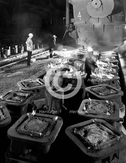 Pig casting at the Park Gate Iron & Steel Co, Rotherham, South Yorkshire, 1964. Creator: Michael Walters.