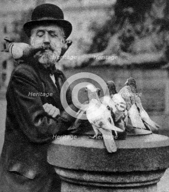 Pigeons of St Paul's with a vagrant, London, 1926-1927.Artist: McLeish