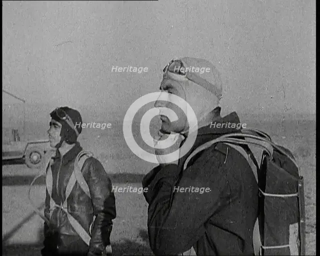 Pilot and Rear Gunner of Biplane Readying Themselves To Board Their Plane With One Adjusting...,1937 Creator: British Pathe Ltd.