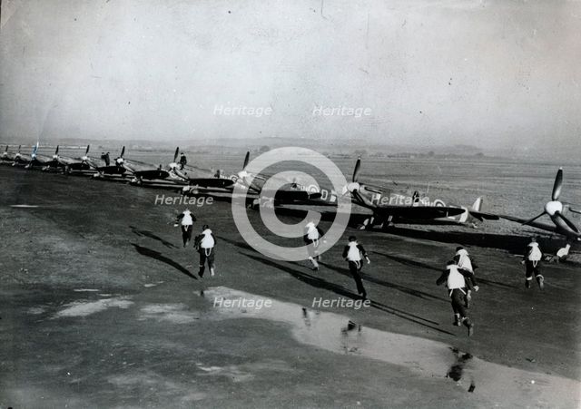 Pilots running to their aircraft, Battle of Britain, 1940. Creator: Unknown.