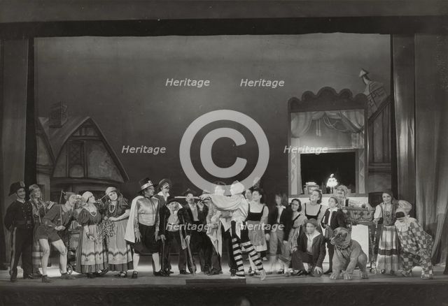 Pinocchio cast with man pointing sticks, 1938-1939. Creator: Unknown.