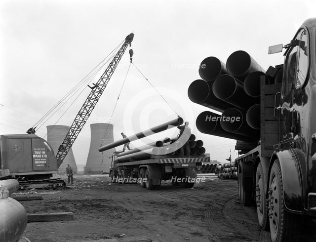 Pipe wrapping to prevent corrosion on steel pipes, Old Denaby, South Yorkshire, 1961. Artist: Michael Walters