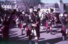 Gallery image of Pipers sounding 'The Retreat', Portree, Isle of Skye, Scotland, c1955.  Creator: Arthur Charles Kirby Ware.