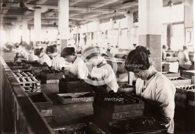 Piping whipped cream walnuts, Rowntree factory, York, Yorkshire, 1920. Artist: Unknown