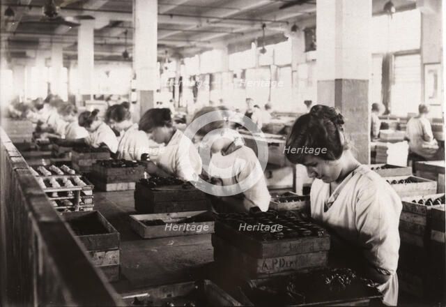 Piping whipped cream walnuts, Rowntree factory, York, Yorkshire, 1920. Artist: Unknown
