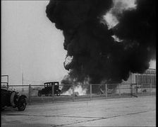 Plume of Flame Burning with Cars Nearby, 1933. Creator: British Pathe Ltd
