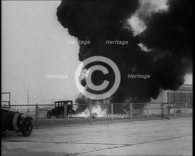 Plume of Flame Burning with Cars Nearby, 1933. Creator: British Pathe Ltd.