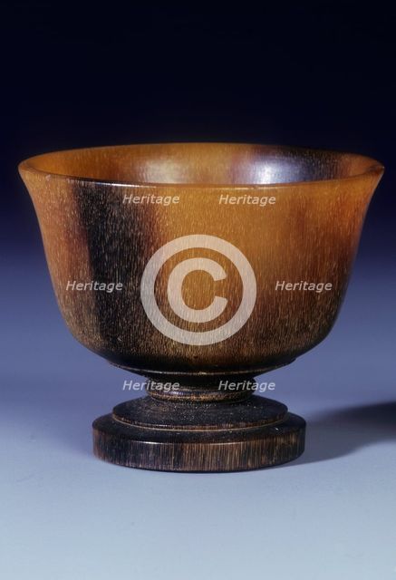Plain circular rhino horn cup with turned stepped foot and stem, Qing dynasty, China, 18th century. Artist: Unknown