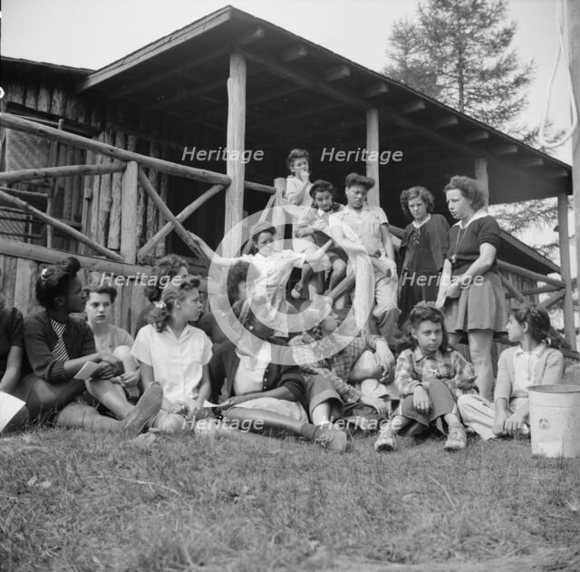 Planning a day's activity at Camp Gaylord White, Arden, New York, 1943. Creator: Gordon Parks.