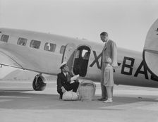 Plant quarantine inspector examining baggage, Glendale, California, 1937. Creator: Dorothea Lange