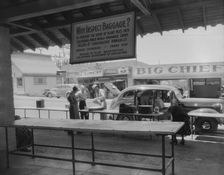 Plant quarantine inspector examining tourist baggage..., Yuma, Arizona, 1937. Creator: Dorothea Lange
